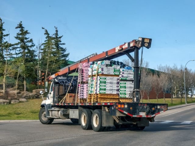 Roofing-Material-Delivery-Scheduling | Summit Exteriors Roofing material delivery to residential project site by Summit Exteriors